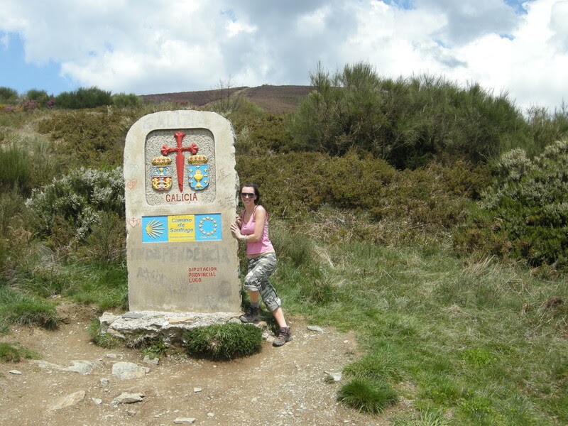 Brittany posing at the Galicia sign along the Camino